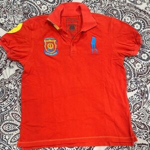 Plain Jane Homme Red Polo Shirt with Blue and Yellow Logo